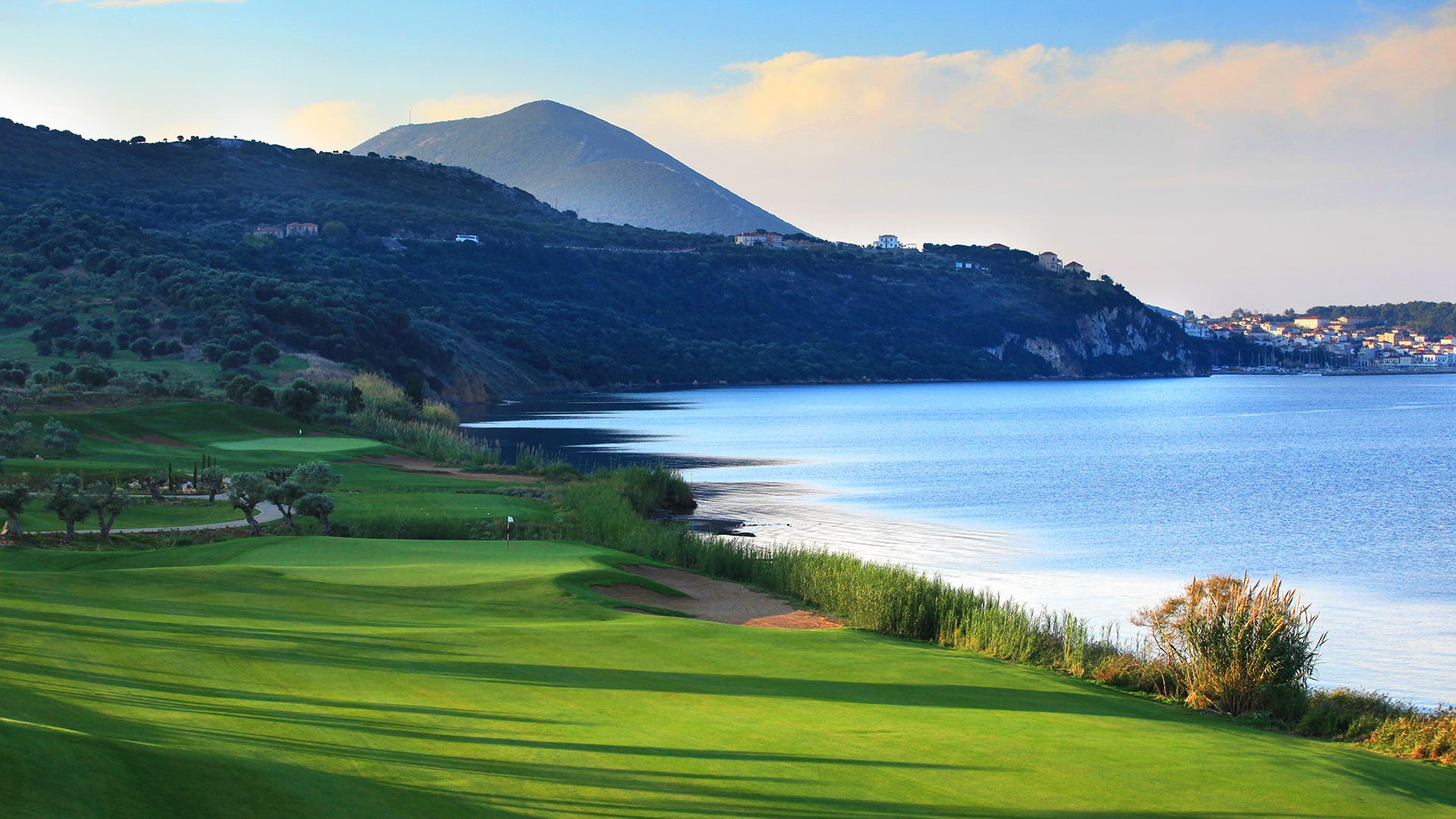 The Bay course fairway beside Navarino Bay, with Pylos behind