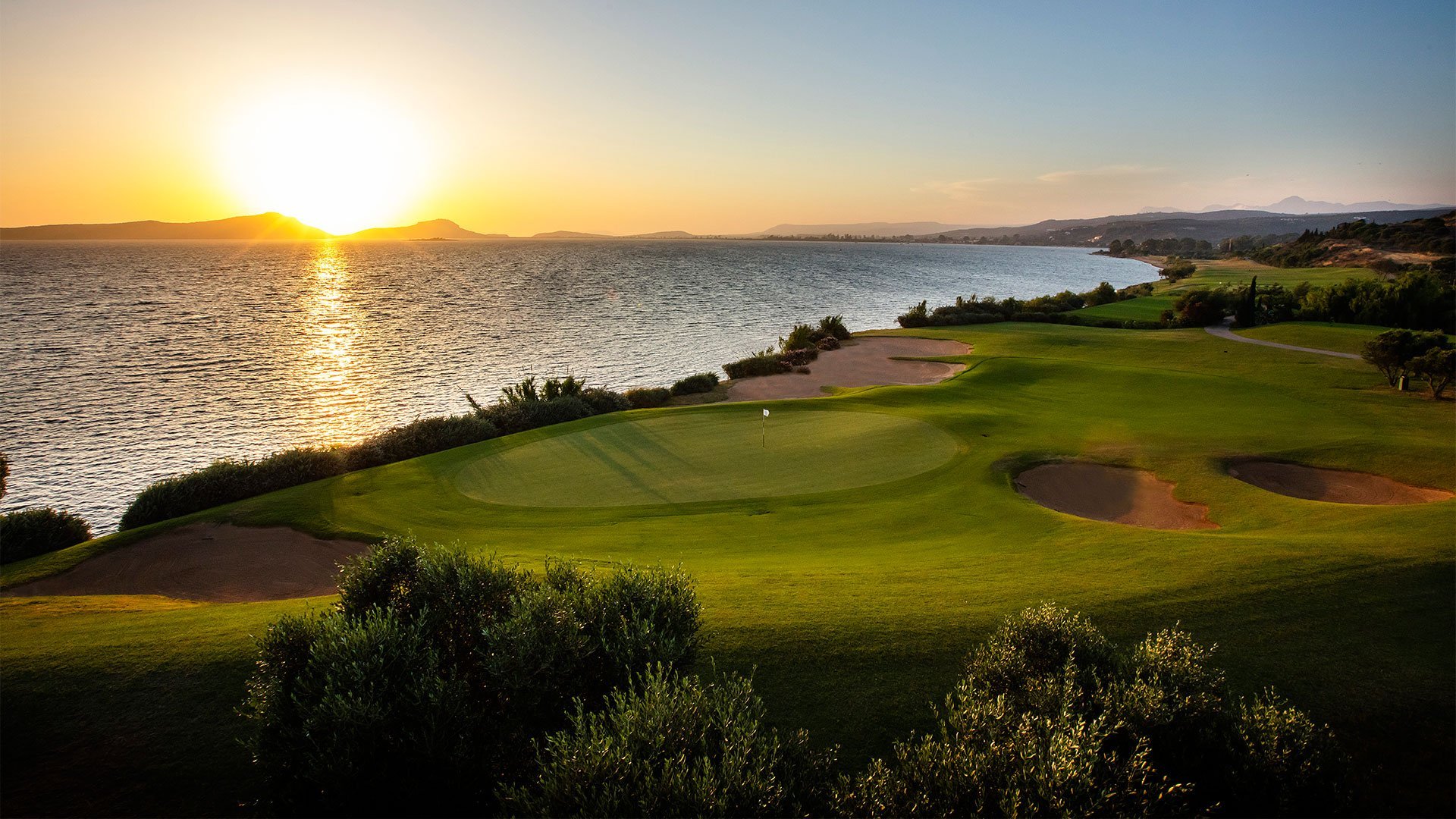 Seaside green on The Bay course above Navarino Bay at sunset