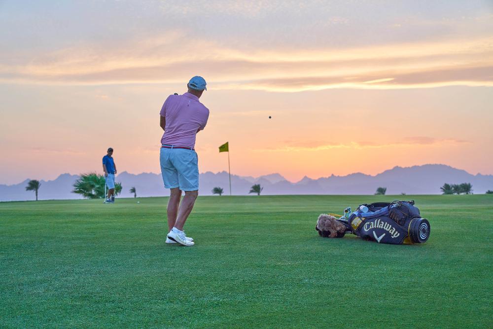 Golfer practising at sunset in Somabay