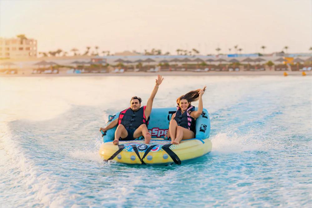 Guests on an inflatable ride on the Red Sea